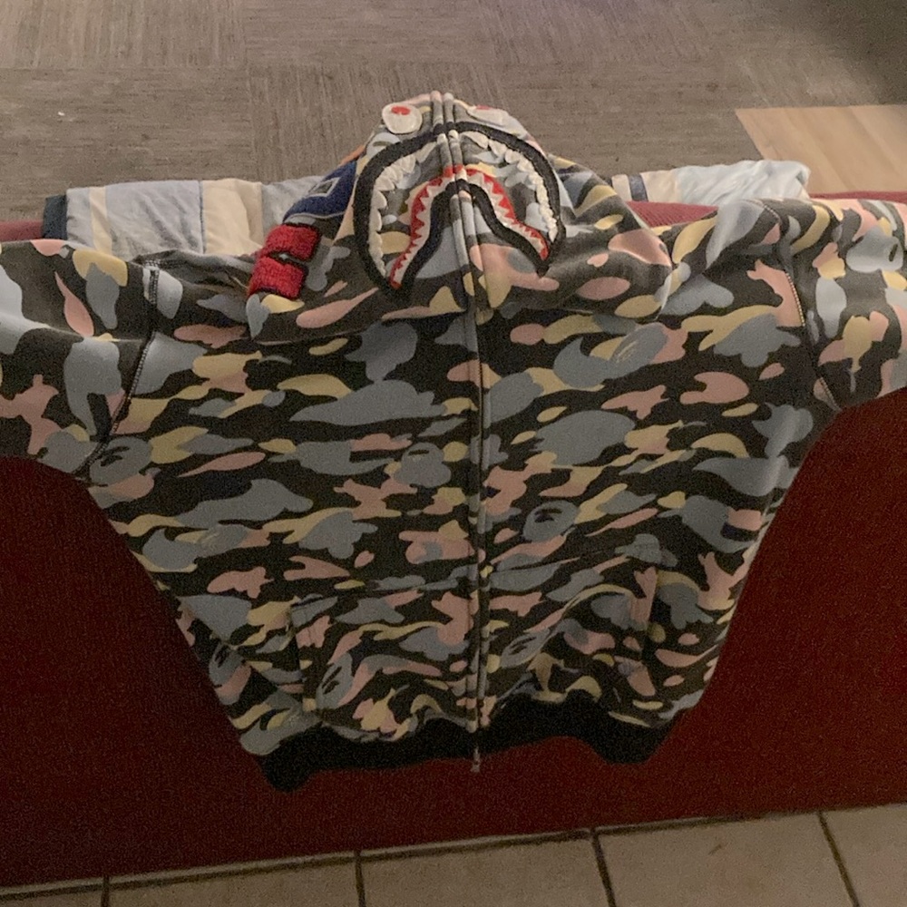 This is a authentic A Bathing Ape zip up over the face hoodie